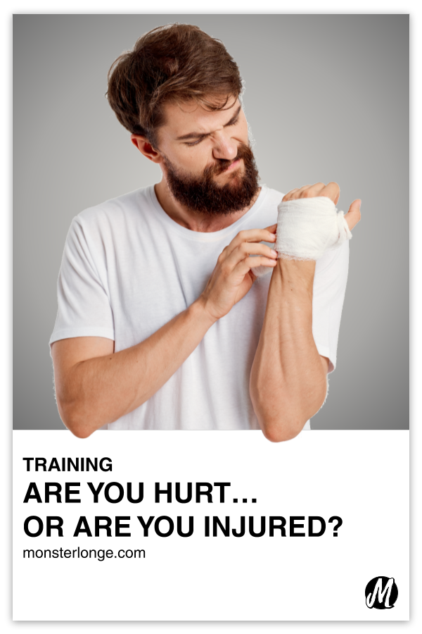 Are You Hurt …Or Are You Injured?!?! written in text with an image of a bearded white male holding a bandaged hand to his face.