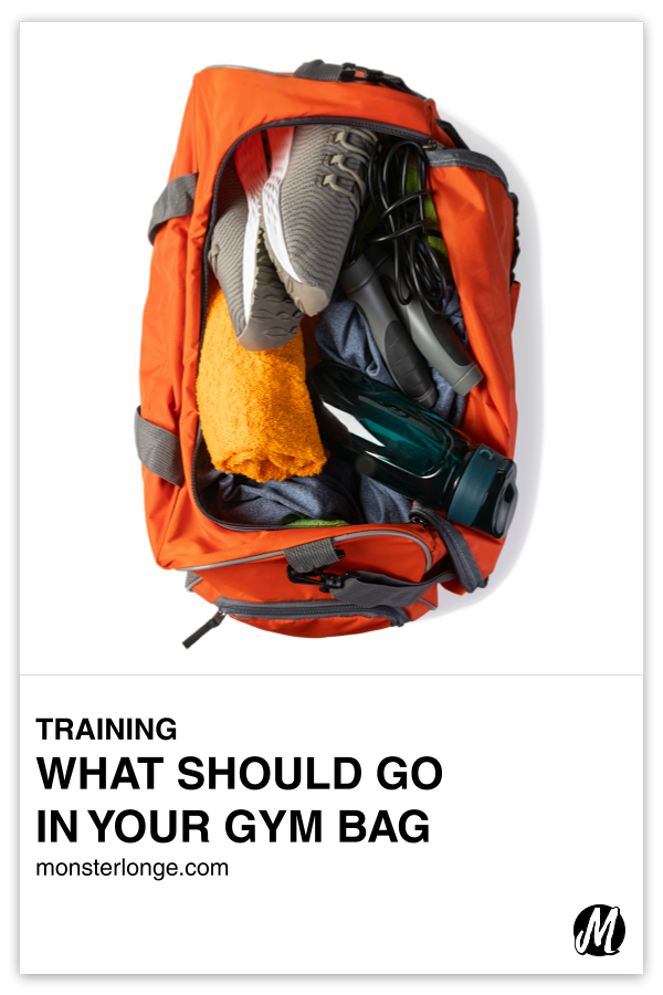 What Should Go In Your Gym Bag written in text with flat overlay image of an open gym exposing sneakers, clothes, and other items inside of it.