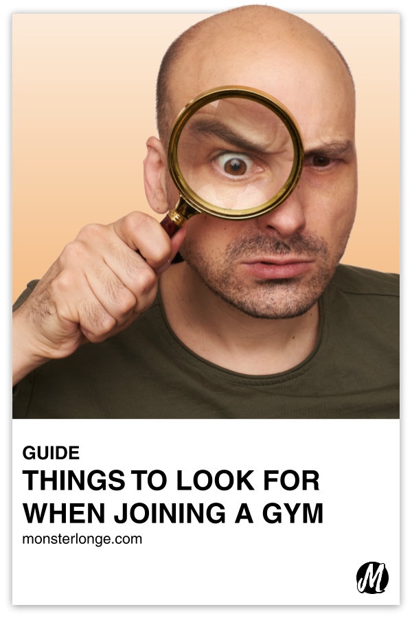 Things To Look For When Joining A Gym written in text with image of a man holding a magnifying glass to his eye.