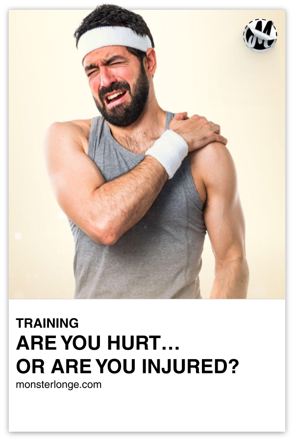 Are You Hurt …Or Are You Injured?!?! written in text with an image of a bearded white male holding his shoulder with a look of pain on his face.